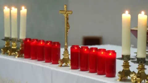 PA Media ten red candles lit