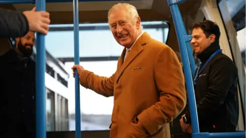 PA Media King Charles in a Dart carriage