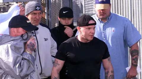 Pacemaker Loyalist prisoner Johnny Adair (wearing a black T-shirt and reversed baseball cap) is release from the Maze Prison