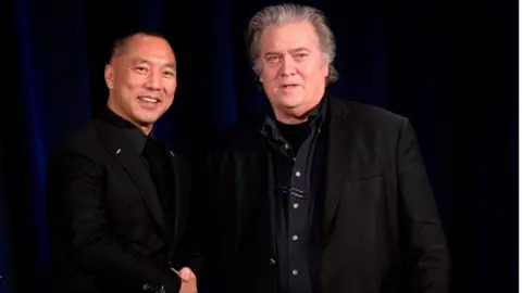 Getty Images Mr Guo and Mr Bannon pictured together in 2018