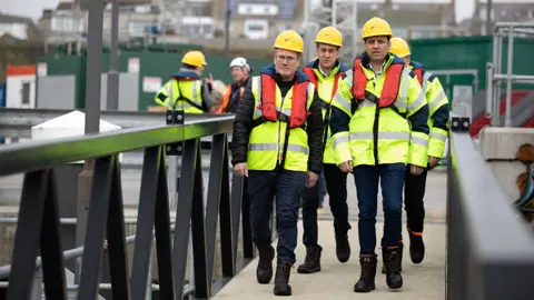 PA Media Sir Keir Starmer with Ed Miliband and Anas Sarwar