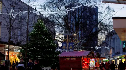 Portsmouth City Council Christmas tree with lights, and over head street lights, in Portsmouth