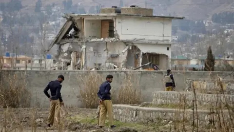 Reuters Policemen stand guard near the partially demolished compound where al Qaeda leader Osama bin Laden was killed by US special forces last May, in Abbottabad this February 26, 2012 file photo.