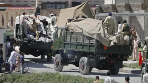 Reuters Soldiers and residents stand over covered debris as it is moved out by military vehicles from the compound within which al Qaeda leader Osama bin Laden was killed, in Abbottabad in this May 2, 2011