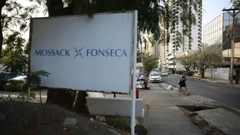 Getty Images A sign for the law firm Mossack Fonseca and Co is seen across the street from the building on 7 April 2016 in Panama City, Panama