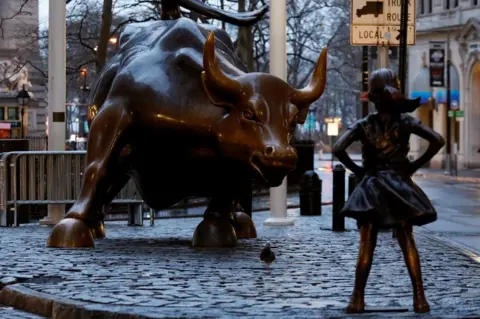 Reuters A statue of a girl facing the Wall St bull