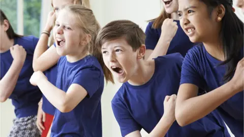 Getty Images children enjoying drama class