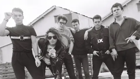 INXS INXS in 1987 (L-R): Jon Farriss, Michael Hutchence, Kirk Pengilly, Garry Gary Beers, Andrew Farriss, Tim Farriss