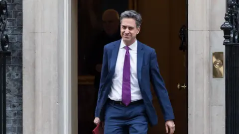 Getty Images Energy Secretary Ed Miliband leaving Number 10 Downing Street.