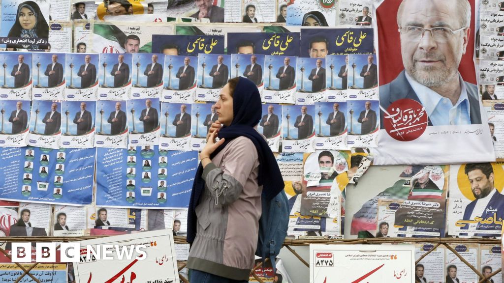 Record low turnout in polls as hardliners win