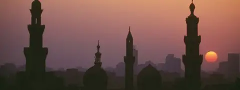 Getty Images Cairo minarets in the sunset