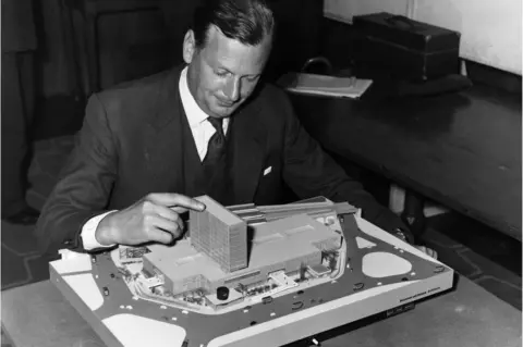 George W. Hales Paul Boissevain, architect for the Willett group of Companies with a model of the Group's plan for the Elephant and Castle shopping centre which has been chosen by the LCC.