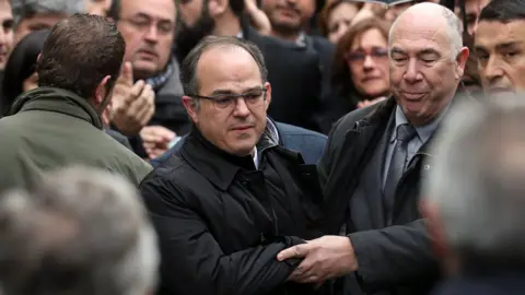 Reuters Catalan politician Jordi Turull returns to the Supreme Court during a break in proceedings as part of an investigation into Catalonia's banned bid for independence