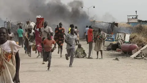 Getty Images South Sudanese civilians flee fighting in an United Nations base in the north-eastern town of Malakal on February 18, 2016