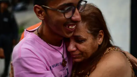AFP Venezuelan Yamileh Saleh (C), mother of opposition student leader Lorent Gomez Saleh, gestures outside the El Helicoide -the Bolivarian National Intelligence Service (SEBIN) prison- in Caracas on October 12, 2018.