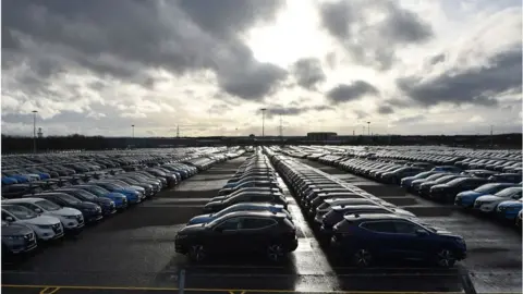 Getty Images Nissan cars parked in a lot at its' Sunderland plant