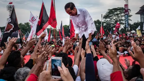 Getty Images Indonesian incumbent Presidential candidate Joko Widodo, is greeted by his supporters at the Sriwedari stadium during election campaign rally on April 9, 2019 in Solo, Central Java, Indonesia.