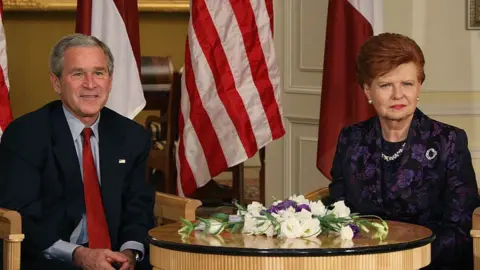 Getty Images Vaira meeting former President George W Bush in Riga, 2006