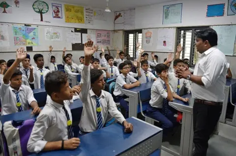 Getty Images Suresh Kumar take the happiness class, an initiative of Delhi Government in every government school till 8th class at Kautilya Government Sarvodaya Bal Vidyalaya, Chirag Enclave, on August 21, 2018 in New Delhi, India.