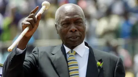 AFP In this file photo taken on October 09, 2001 Kenyan president, Daniel Arap Moi, waves to the crowd while he enters in the National Stadium to celebrates Moi day in Nairobi Kenya 10 October, 2001.
