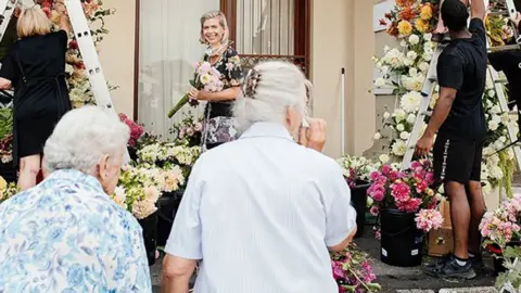 Adene's Farm Flowers Residents at the Huis Vergenoegd Old Age Home in Paarl, South Africa looking at the flowers