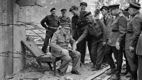 Getty Images Winston Churchill sitting on a chair outside Hitler's bunker 1945