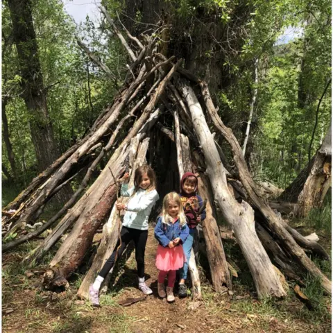 Alyssa Hulme Alyssa Hulme's children building fairy houses.