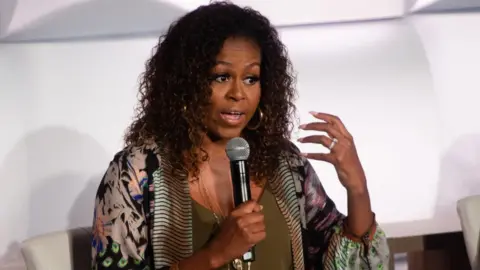 Getty Images Michelle Obama is pictured at the 2019 Beating the Odds Summit