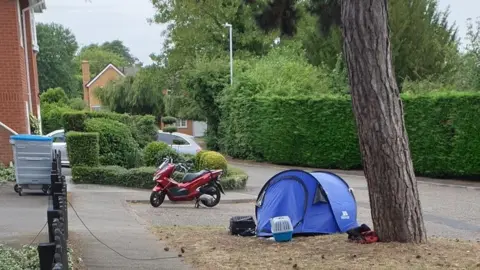 Submitted  Tent set up in a street