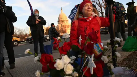 Getty Images A woman cries at a makeshift memorial to Babbitt in Washington, where she died