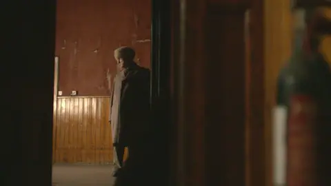 Peter in the derelict restaurant