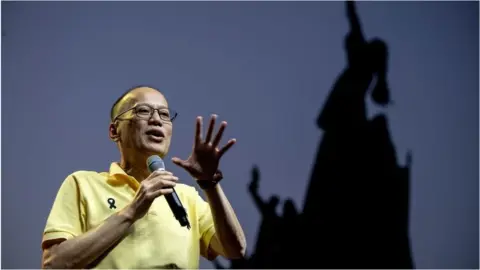 Getty Images Former Philippine president Benigno Aquino delivers a speech ahead of the commemoration of the 33rd anniversary of the "People Power" revolution in Manila on 23 February 2019.