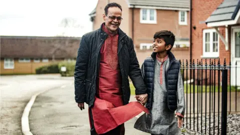 Getty Images Muslim boy and his grandfather in street