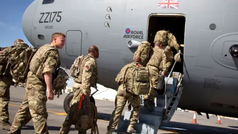 Getty Images British troops board a RAF C-17 as they leave Afghanistan to go home at Kandahar airfield in 2014