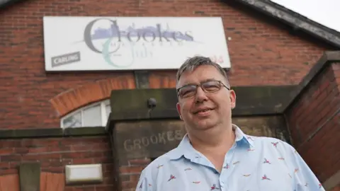 Oli Constable/BBC Maurice Champeau outside Crookes Social Club