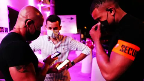 Getty Images vaccine passport at nightclub