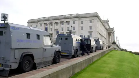 Getty Images A police raid on Sinn Féin's Stormont offices in 200