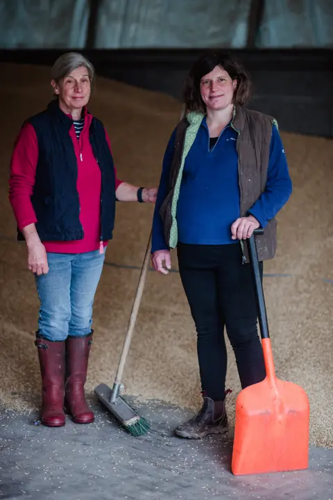 Joanne Coates Anna stands with her mother on their farm in north Northumberland