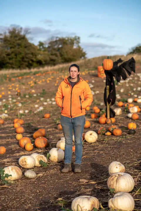 Joanne Coates Annabel stands in a pumpkin patch in St Abbs village in the Scottish Borders