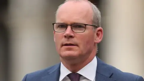 PA Media Simon Coveney