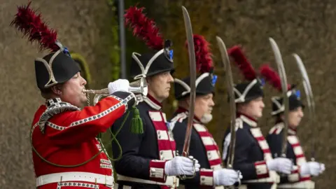PA/Liam McBurney Sergeant Bugler Andrew Carlisle with the Hillsborough Fort Guard during a remembrance service for Queen Elizabeth II at Hillsborough Fort in Northern Ireland. Picture date: Monday