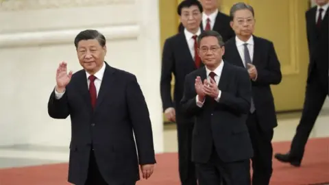 EPA Chinese President Xi Jinping (L) leads the new members of the Standing Committee of the Political Bureau of the 20th Chinese Communist Party