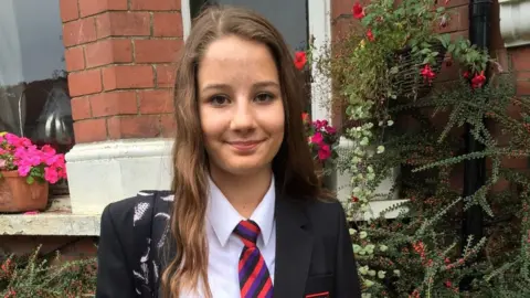 PA Media Molly Russell, who was 14 when she ended her life after viewing harmful online material