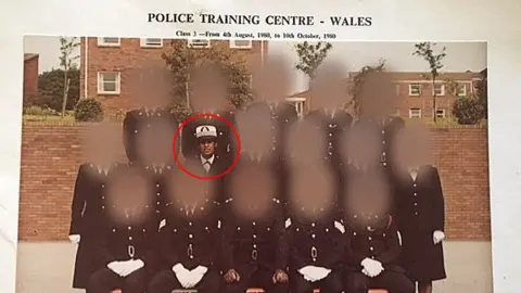 Adora Pomphrey  Adora in a police group photo in a training centre in Wales