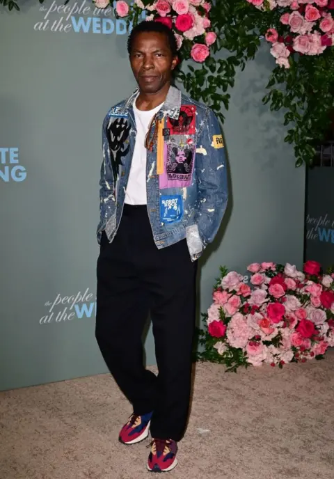 AFP Isaach de Bankole posing in a jean jacket.