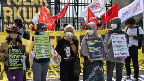 Getty Images Protesters were outside the parliament on Monday