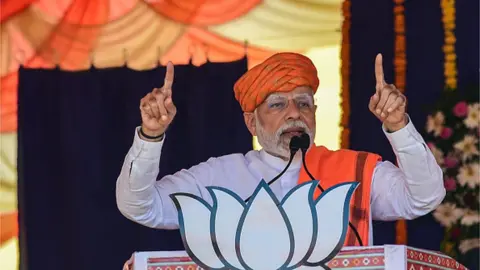 AFP India's prime minister Narendra Modi (C) addresses a gathering during a Bhartiya Janata Party (BJP) rally ahead of Gujarat state elections at Dehgam, some 40 kms from Ahmedabad on November 24, 2022.