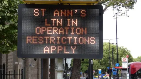 Simon Allin/LDRS An illuminated highway sign warning of the LTN in operation in St Ann's in the borough of Haringey.
