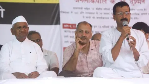 Getty Images Manish Sisodia and Anna Hazare listens to Arvind Kejriwal on the fifth day of Team Anna's agitation at Jantar Mantar in New Delhi on 29 July 2012