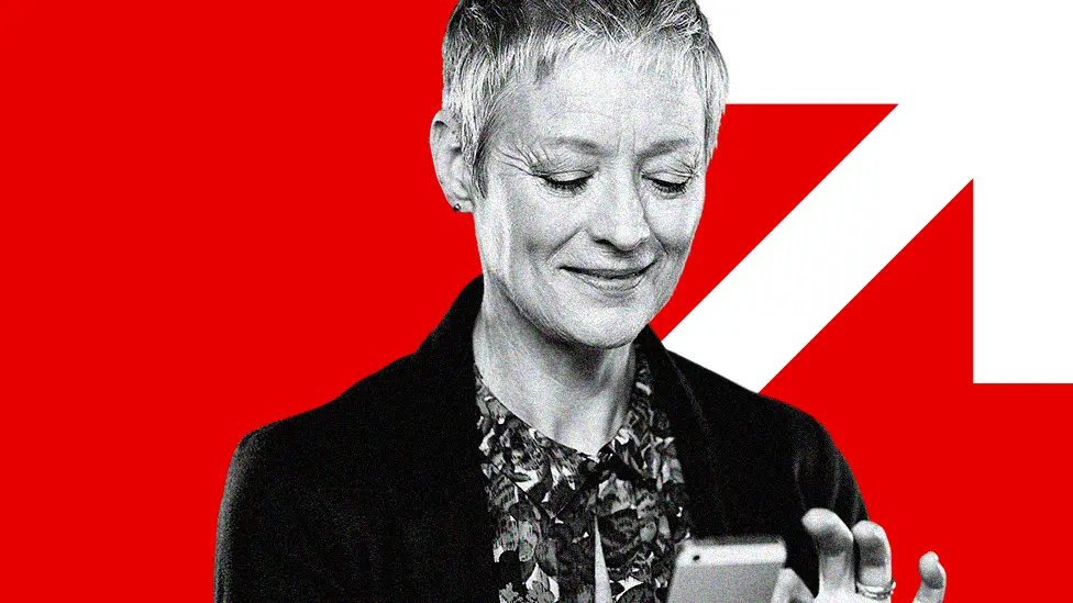 BBC Over-50s woman looking at her phone